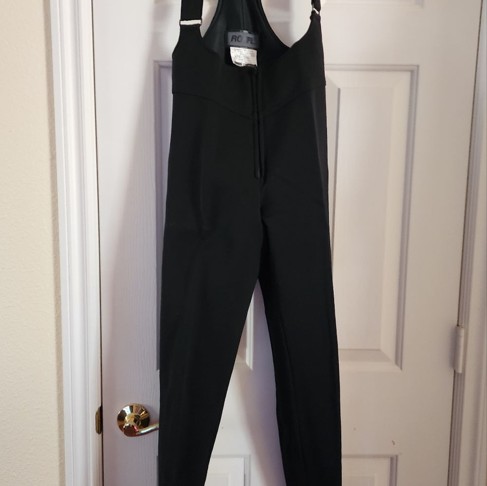 Women's size 6 ski bibs. Excellent condition. Zipper front, boot strap bottom